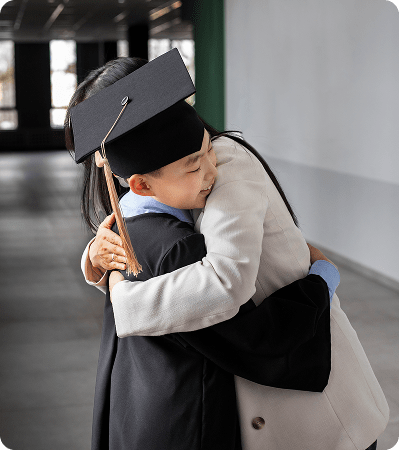 kid-celebrating-kindergarten-graduation-with-parent 1
